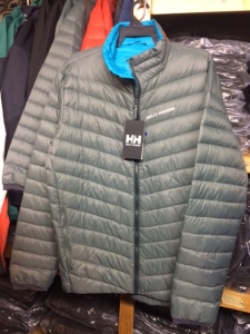 Outerwear puffy down filled jackets for men and women in many different bright colors.